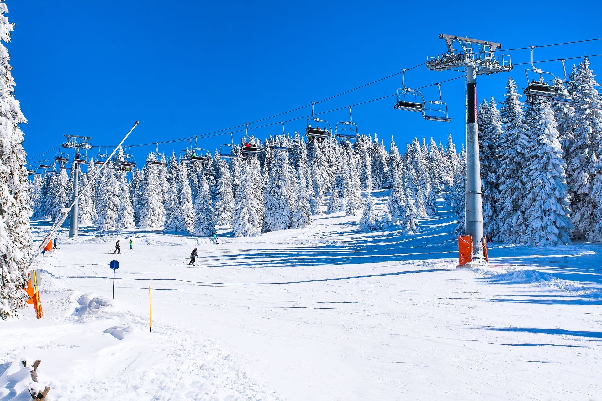 Ski resort Kopaonik, Serbia, ski slope, people on the ski lift, skiers on the slope